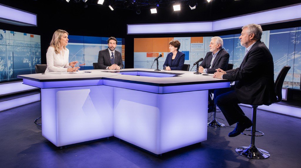 Panel of presenters in an Australian live television news studio